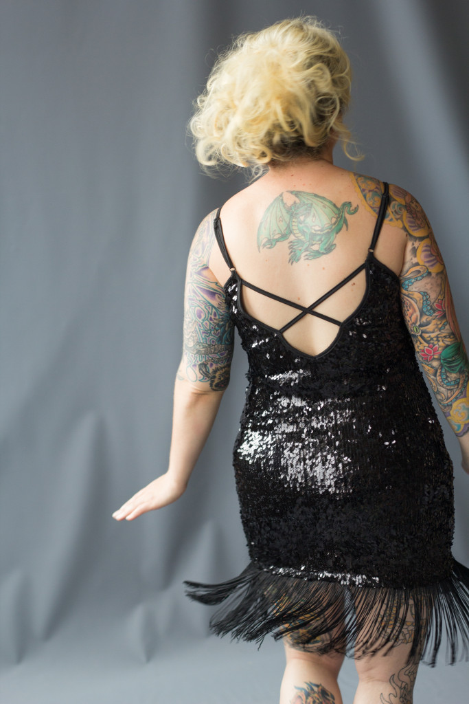 glamour. tattoos. blonde. evening dress. black.